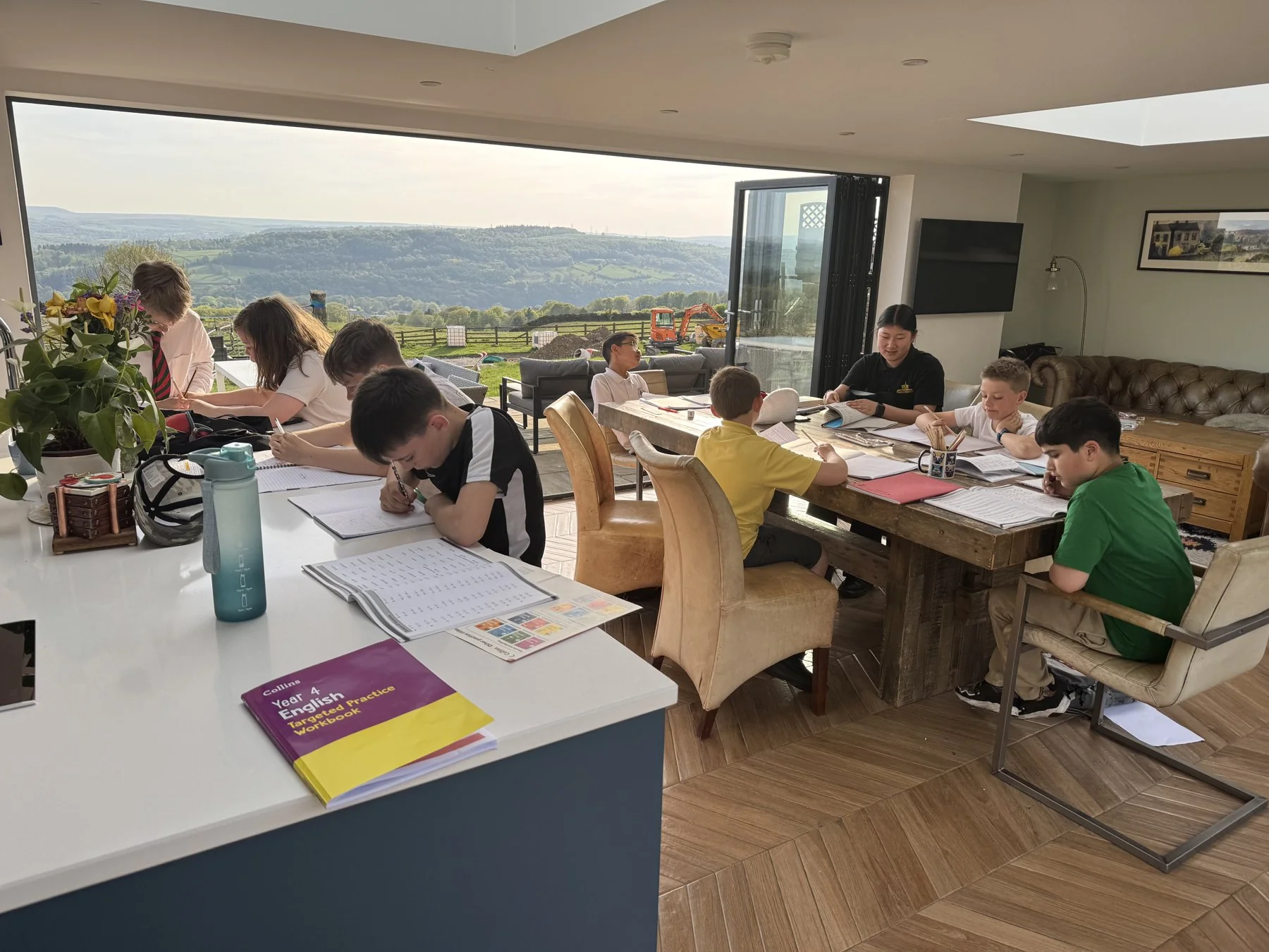 Students learning together in the bright classroom overlooking the Bingley countryside